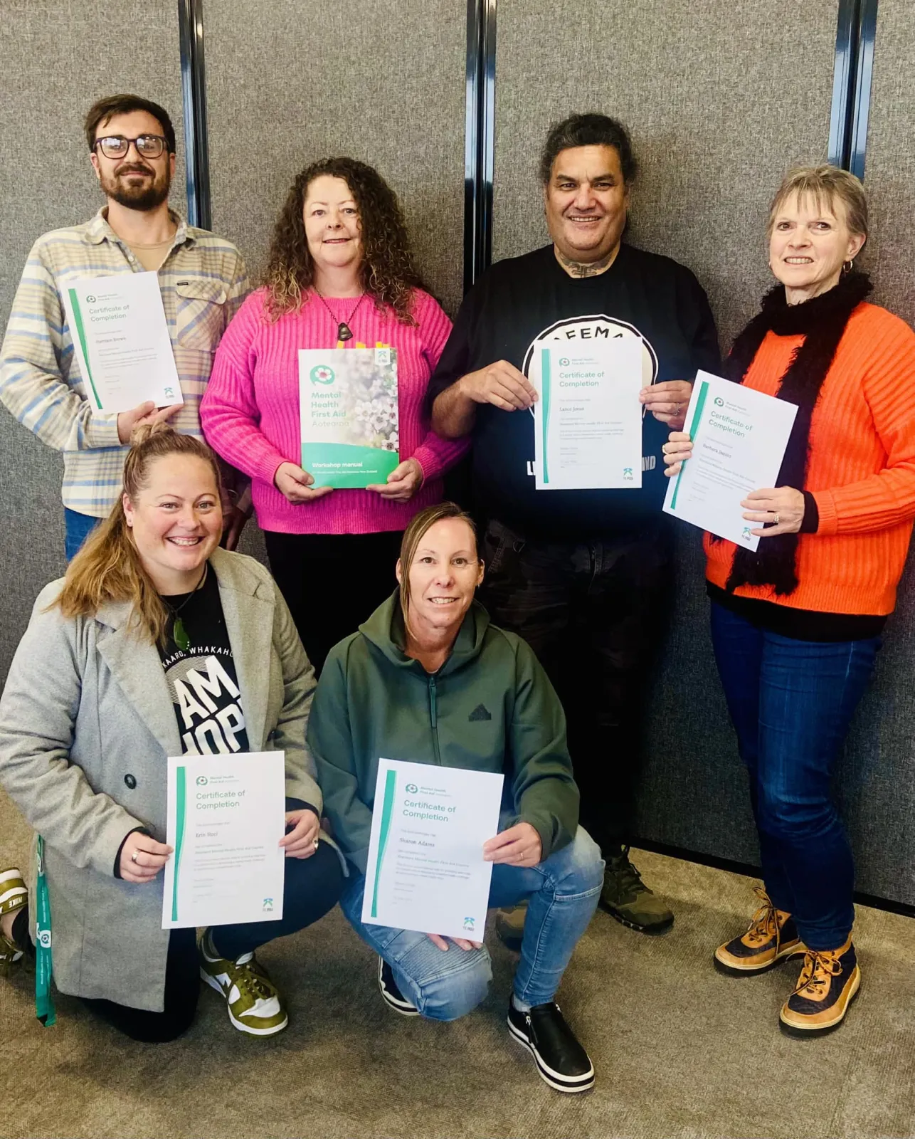 Public workshop participants with their Mental Health First Aid certificates